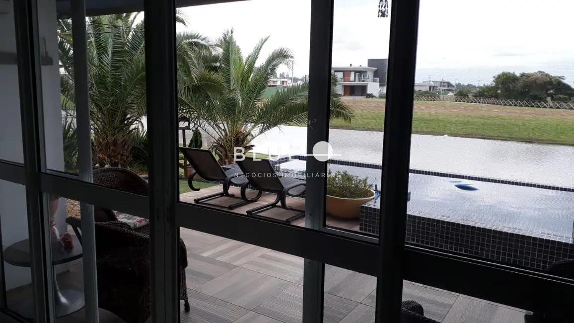 Foto 2 de Casa de Condomínio com 4 quartos à venda, 330m2 em Torres - RS