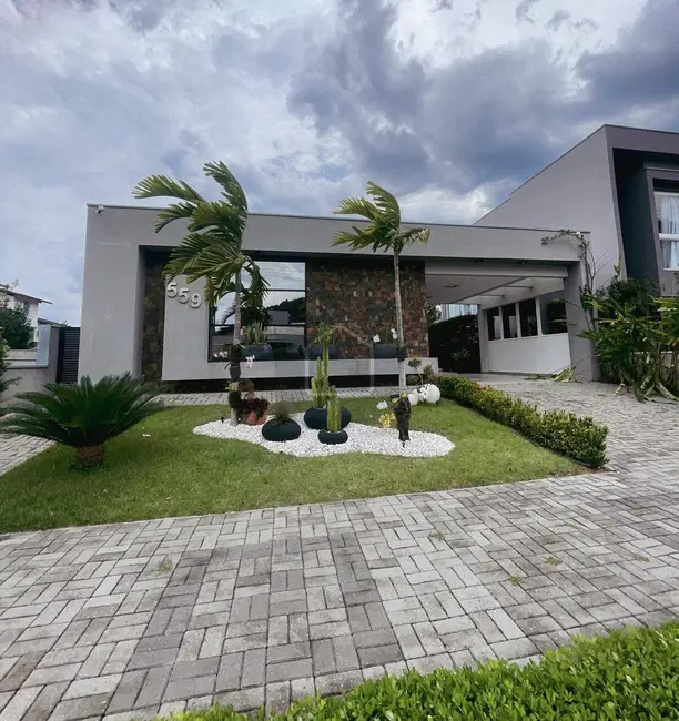 Foto 1 de Casa com 4 quartos à venda, 390m2 em Massaguaçu, Caraguatatuba - SP