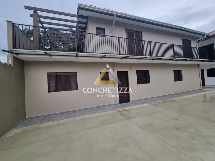 Foto 1 de Sobrado com 3 quartos à venda, 111m2 em Indaiá, Caraguatatuba - SP