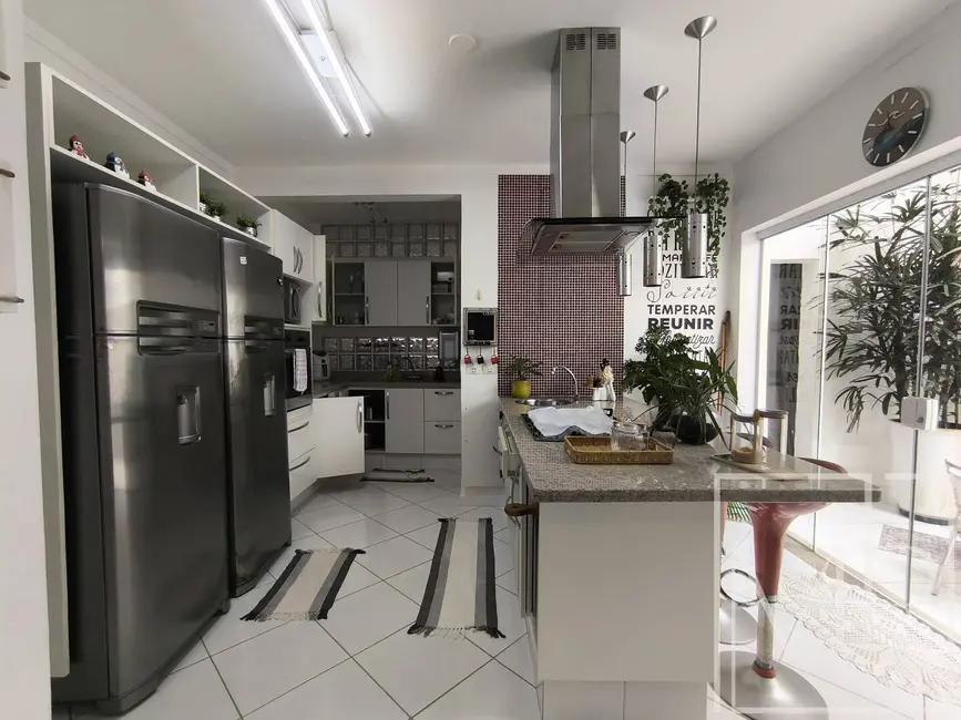 Foto 1 de Casa com 4 quartos à venda e para alugar, 164m2 em Riviera de São Lourenço, Bertioga - SP