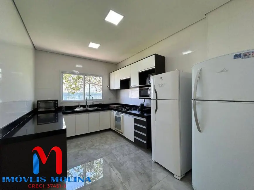 Foto 8 de Casa com 7 quartos à venda e para alugar, 628m2 em Jardim Acapulco, Guaruja - SP