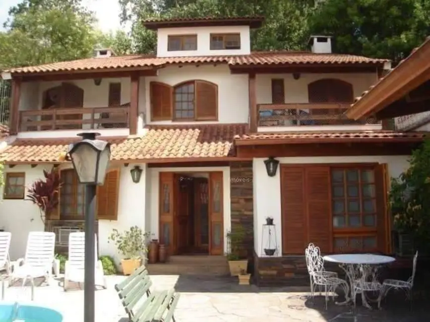 Casa com 3 quartos à venda, 230m2 em Higienópolis, Porto Alegre - RS - imagem 1 Foto 1 de Casa com 3 quartos à venda, 230m2 em Higienópolis, Porto Alegre - RS