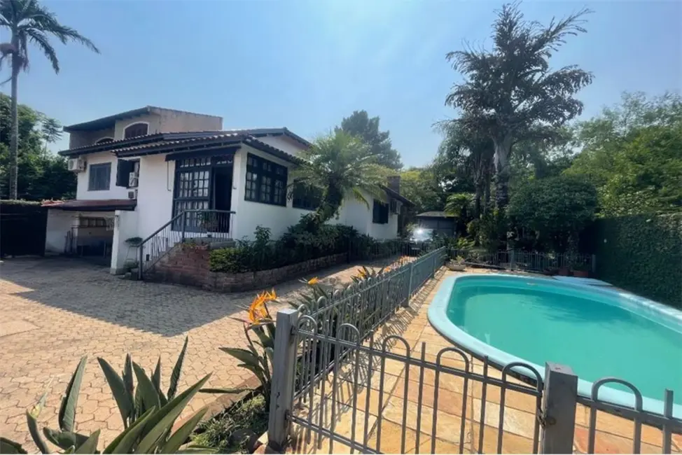 Foto 1 de Casa com 4 quartos à venda, 525m2 em Jardim Sabará, Porto Alegre - RS