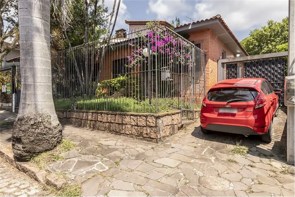 Foto 1 de Casa com 4 quartos à venda, 250m2 em Três Figueiras, Porto Alegre - RS