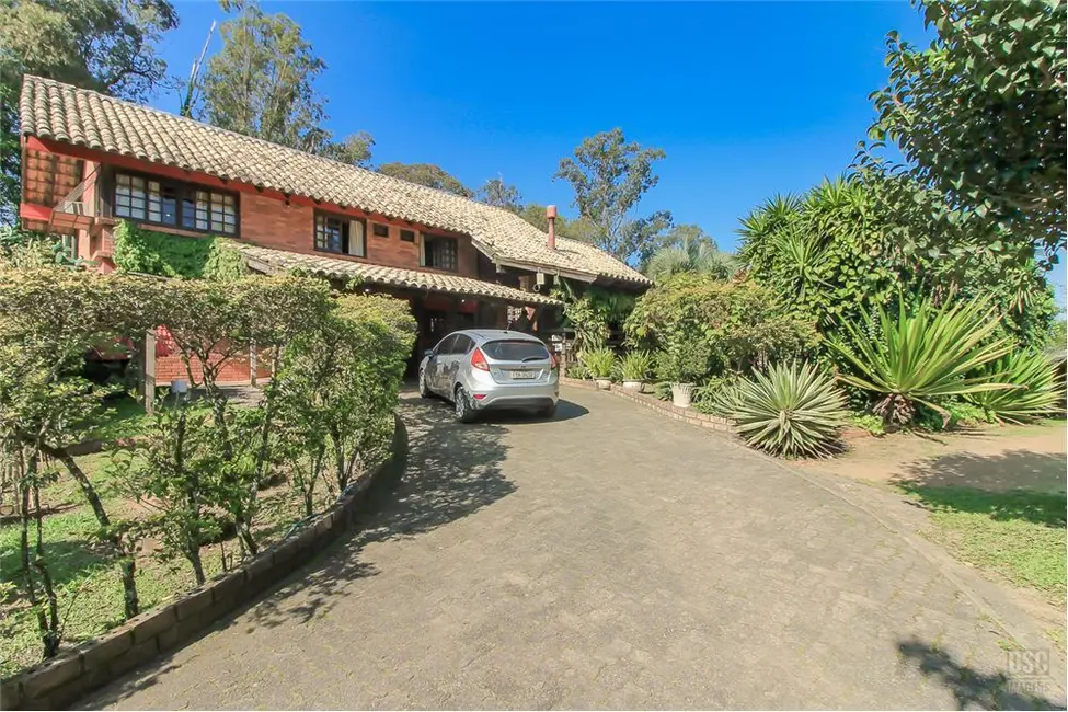 Foto 1 de Casa com 4 quartos à venda, 200m2 em Vila Nova, Porto Alegre - RS