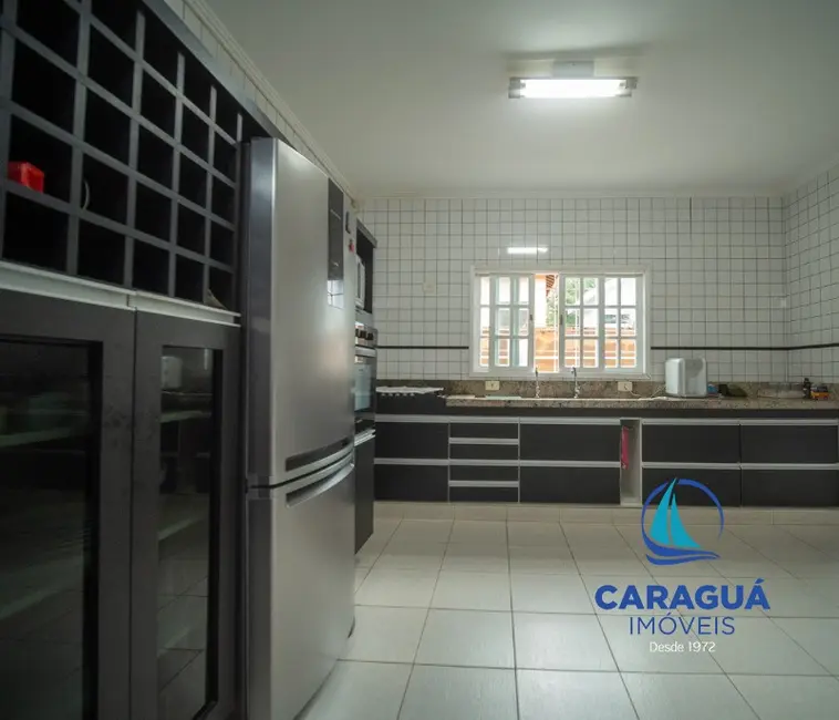 Foto 6 de Casa de Condomínio com 3 quartos à venda, 241m2 em Martim de Sá, Caraguatatuba - SP
