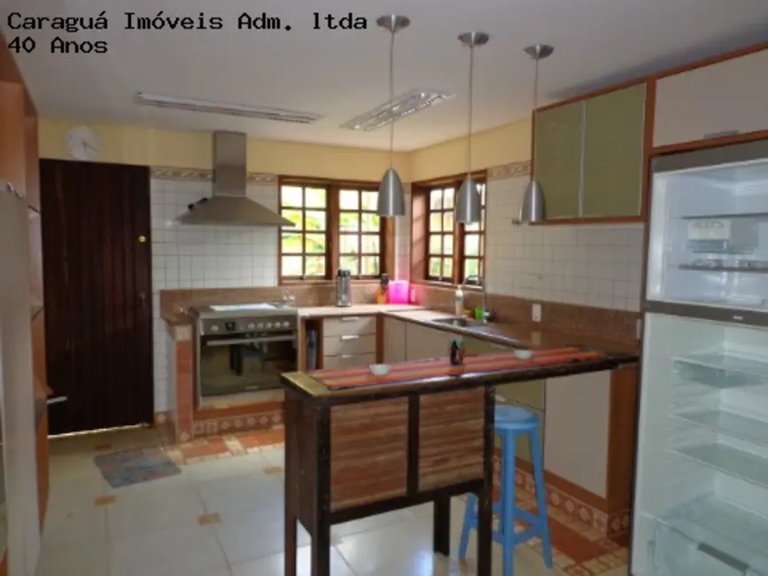 Foto 3 de Casa de Condomínio com 4 quartos à venda e para alugar, 525m2 em Martim de Sá, Caraguatatuba - SP