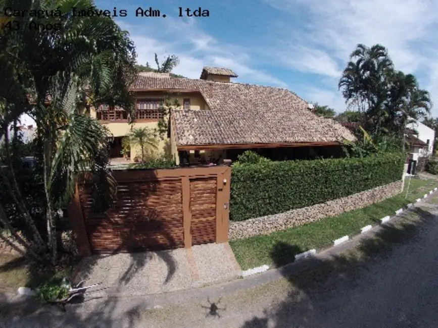 Foto 1 de Casa de Condomínio com 4 quartos à venda e para alugar, 525m2 em Martim de Sá, Caraguatatuba - SP