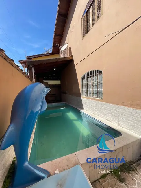 Foto 1 de Casa com 3 quartos à venda, 103m2 em Martim de Sá, Caraguatatuba - SP