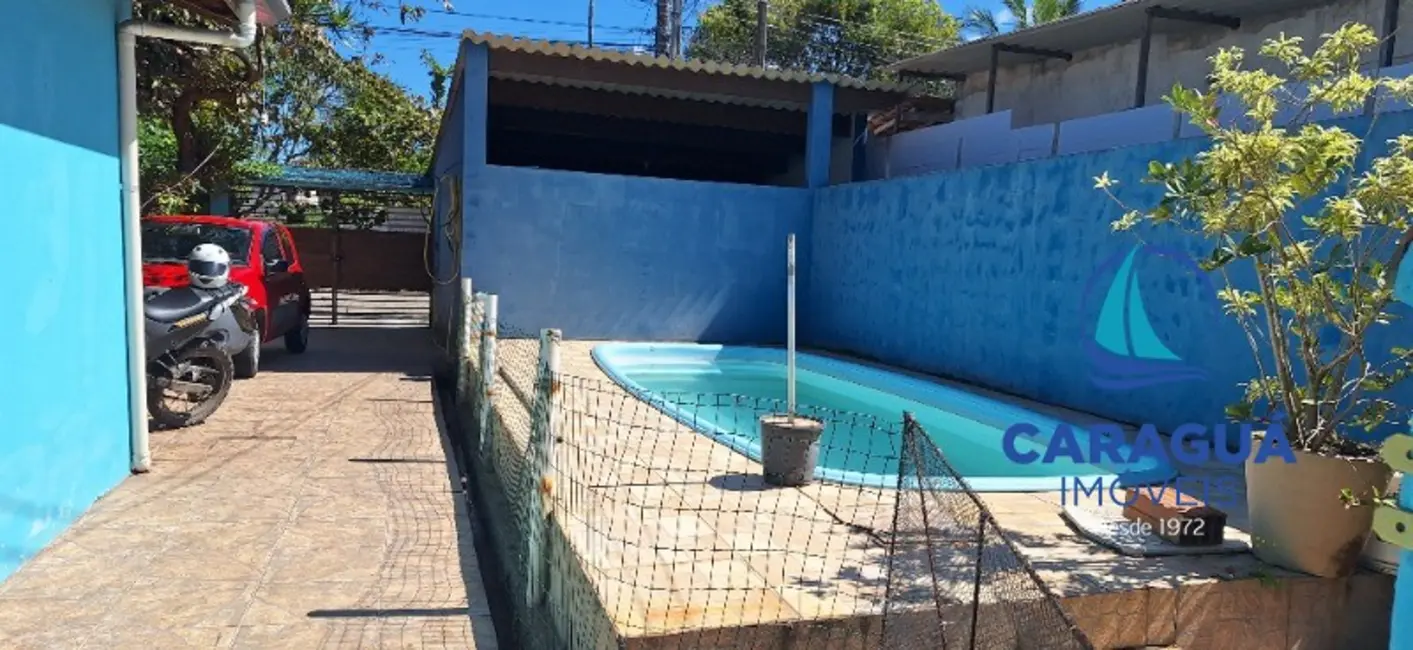Foto 1 de Casa com 4 quartos à venda, 200m2 em Loteamento Jardim Aruan, Caraguatatuba - SP