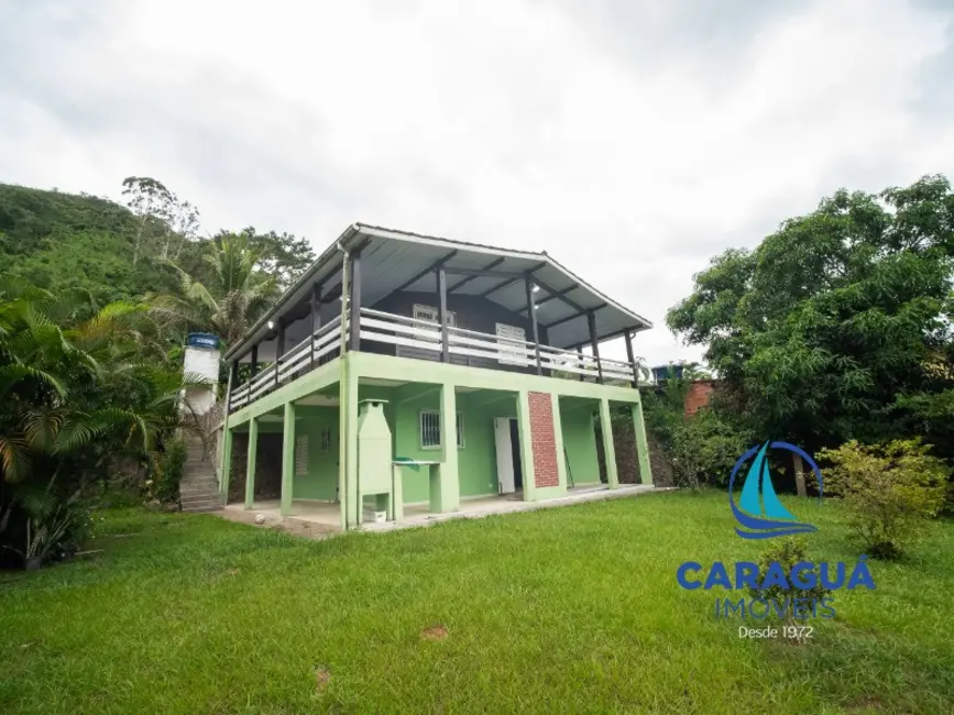 Foto 1 de Casa com 4 quartos para alugar, 200m2 em Martim de Sá, Caraguatatuba - SP