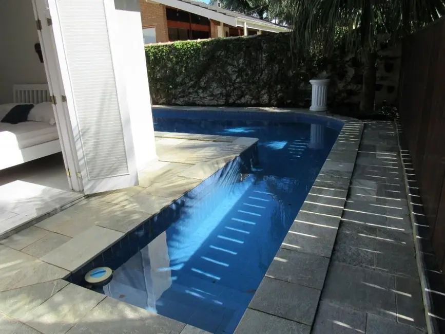 Foto 1 de Casa de Condomínio com 4 quartos à venda, 166m2 em Ubatuba - SP
