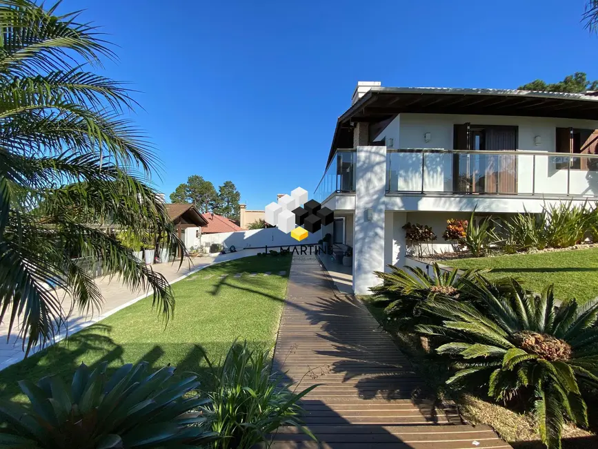 Foto 4 de Casa com 4 quartos à venda, 204m2 em Torres - RS