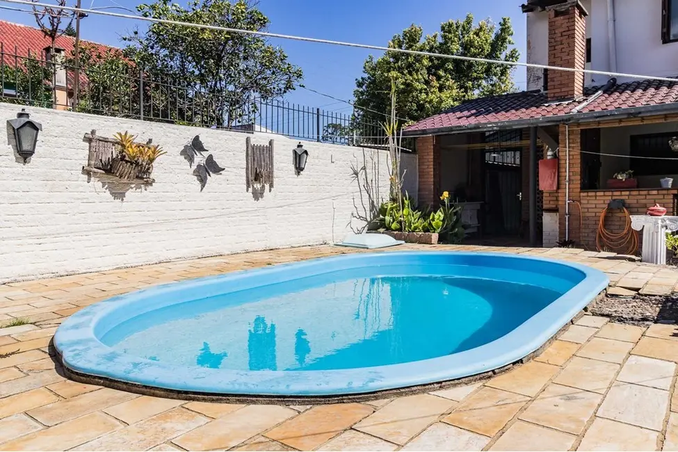 Foto 7 de Casa com 3 quartos à venda, 235m2 em Guarujá, Porto Alegre - RS
