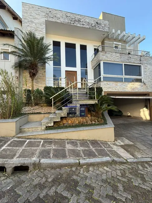 Casa com 3 quartos à venda, 397m2 em Lomba do Pinheiro, Porto Alegre - RS - imagem 1 Foto 1 de Casa com 3 quartos à venda, 397m2 em Lomba do Pinheiro, Porto Alegre - RS