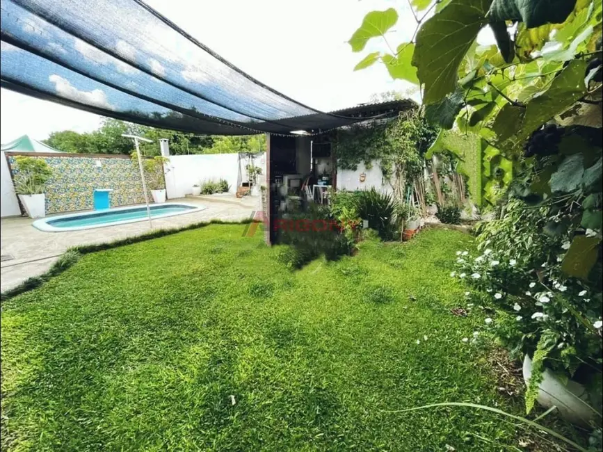 Foto 2 de Casa de Condomínio com 3 quartos à venda, 69m2 em Diácono João Luiz Pozzobon, Santa Maria - RS