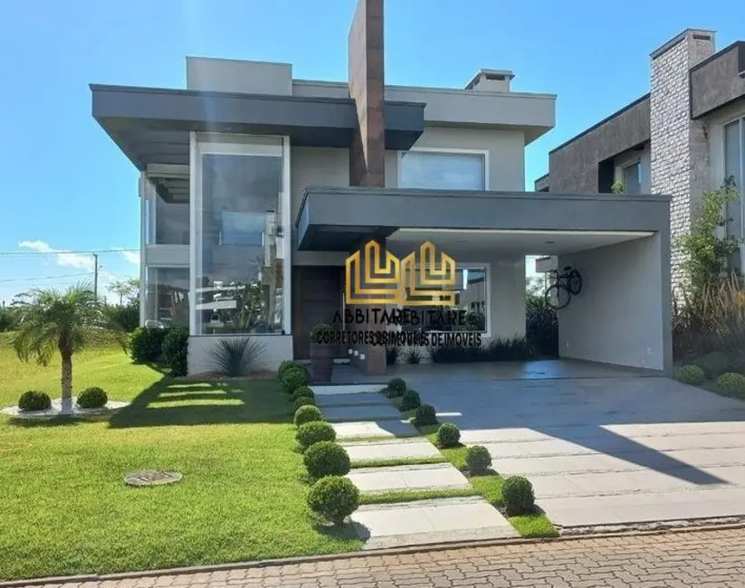 Foto 1 de Casa de Condomínio com 3 quartos à venda, 249m2 em Torres - RS