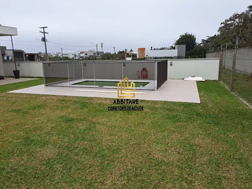 Casa de Condomínio com 3 quartos à venda, 156m2 em Torres - RS - imagem 4 Foto 4 de Casa de Condomínio com 3 quartos à venda, 156m2 em Torres - RS