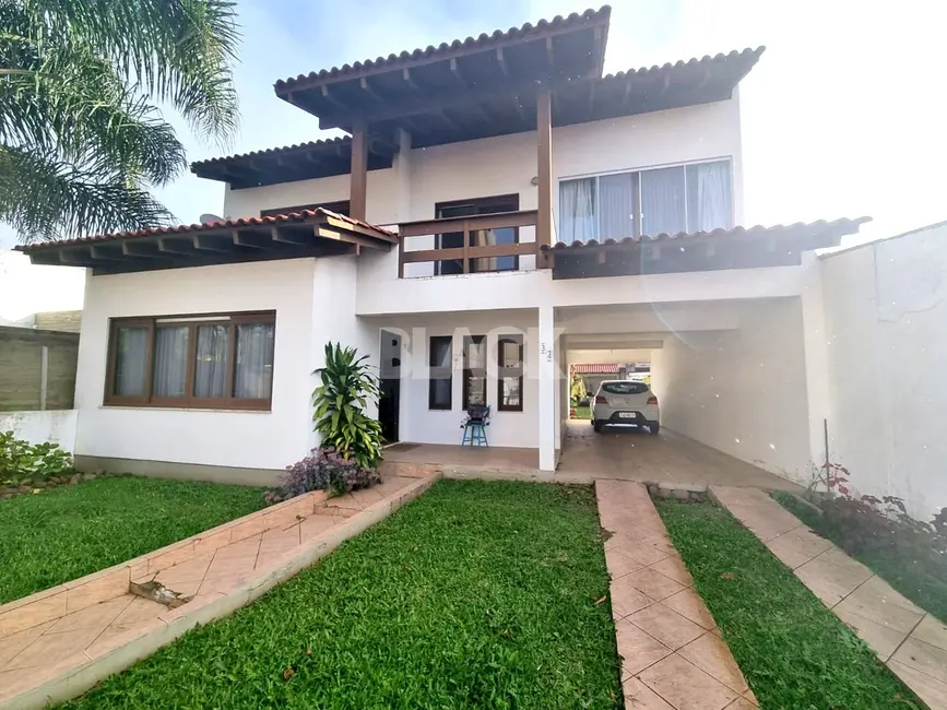 Foto 1 de Casa com 4 quartos à venda, 255m2 em Centro, Torres - RS