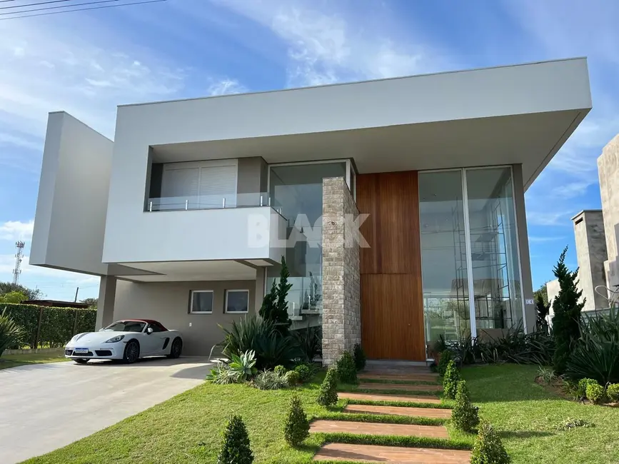 Foto 1 de Casa de Condomínio com 5 quartos à venda, 280m2 em Torres - RS