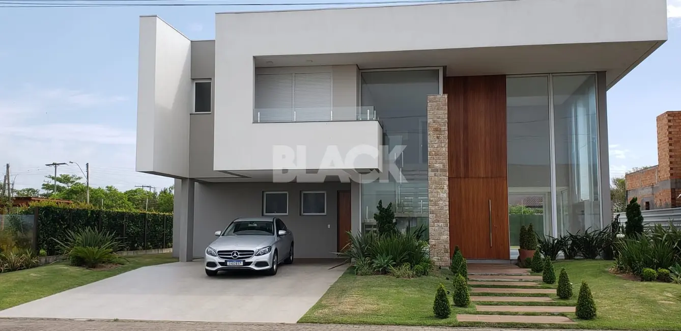 Casa de Condomínio com 5 quartos à venda, 275m2 em Torres - RS - imagem 1 Foto 1 de Casa de Condomínio com 5 quartos à venda, 275m2 em Torres - RS