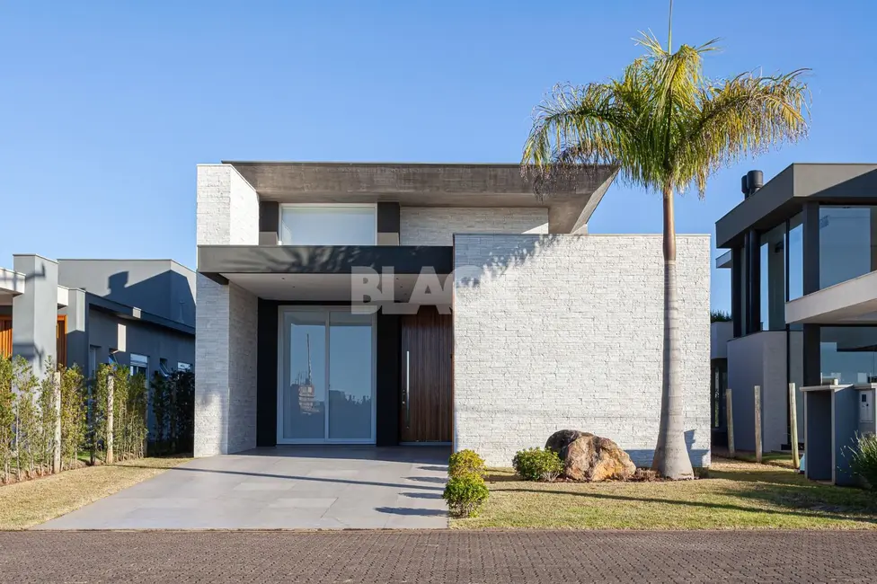 Foto 1 de Casa de Condomínio com 3 quartos à venda, 264m2 em Torres - RS