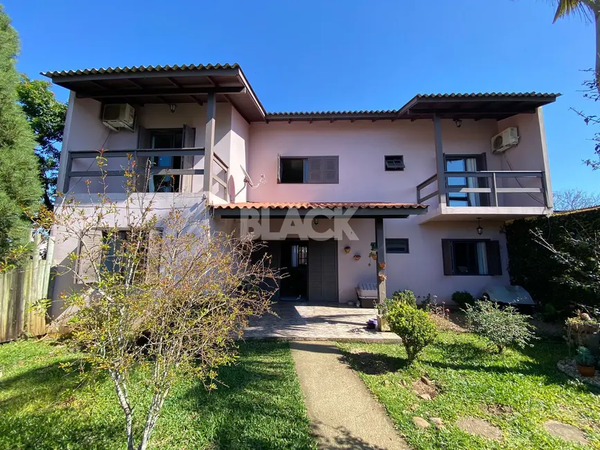 Foto 1 de Casa com 4 quartos à venda, 230m2 em Torres - RS