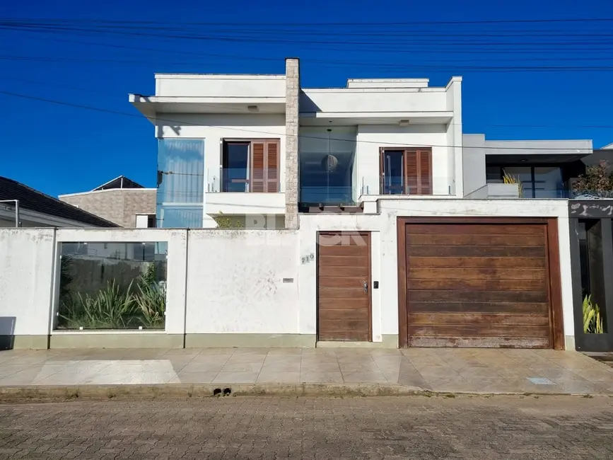 Foto 1 de Casa com 4 quartos à venda, 381m2 em Torres - RS