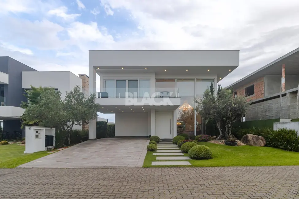 Foto 1 de Casa de Condomínio com 4 quartos à venda, 444m2 em Torres - RS