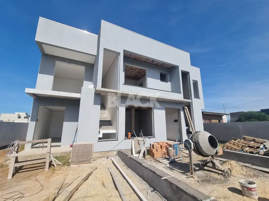 Foto 1 de Casa com 3 quartos à venda, 110m2 em Torres - RS