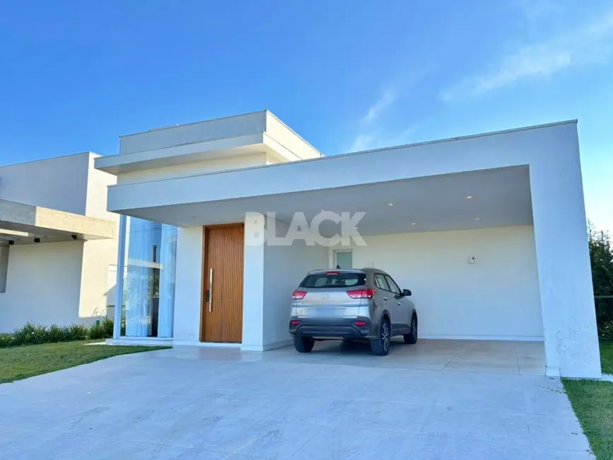 Foto 1 de Casa de Condomínio com 3 quartos à venda, 274m2 em Torres - RS