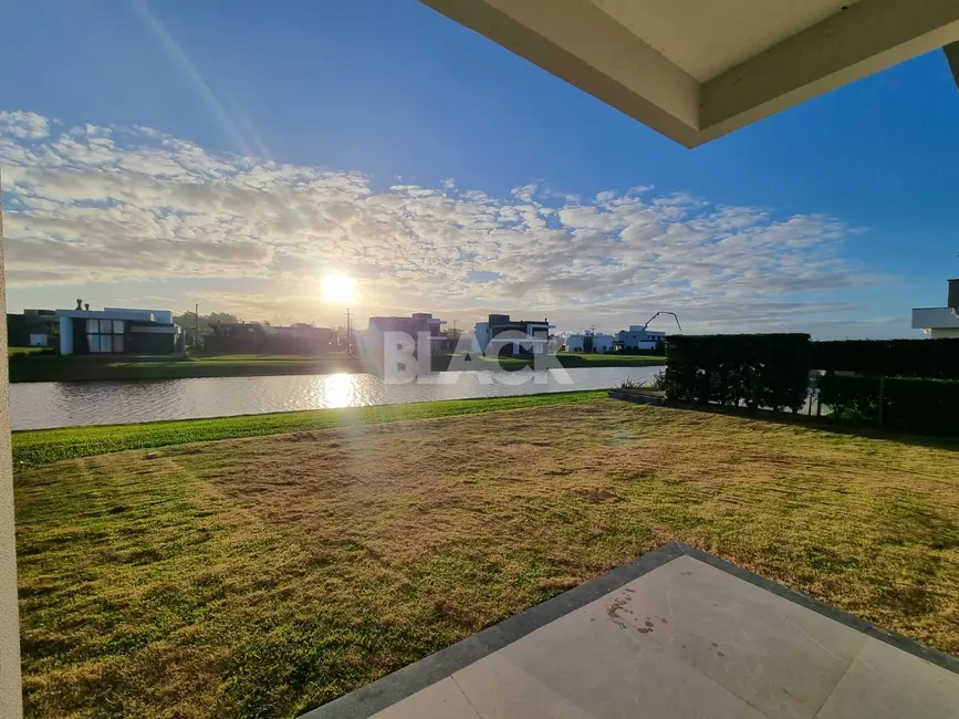 Foto 6 de Casa de Condomínio com 4 quartos à venda, 177m2 em Torres - RS