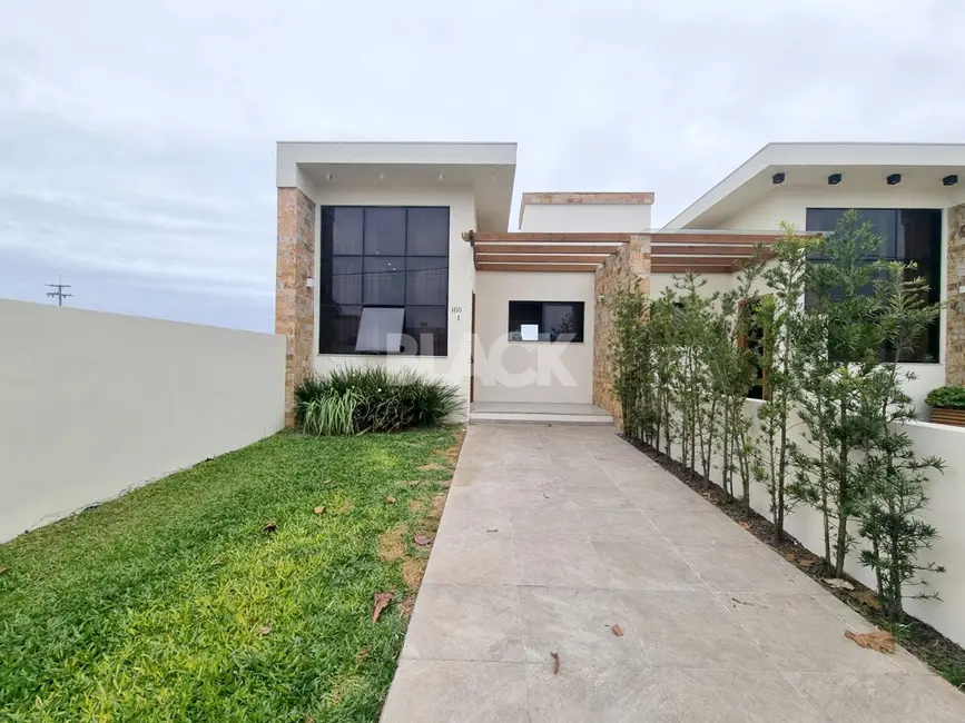 Foto 2 de Casa com 3 quartos à venda, 104m2 em Torres - RS