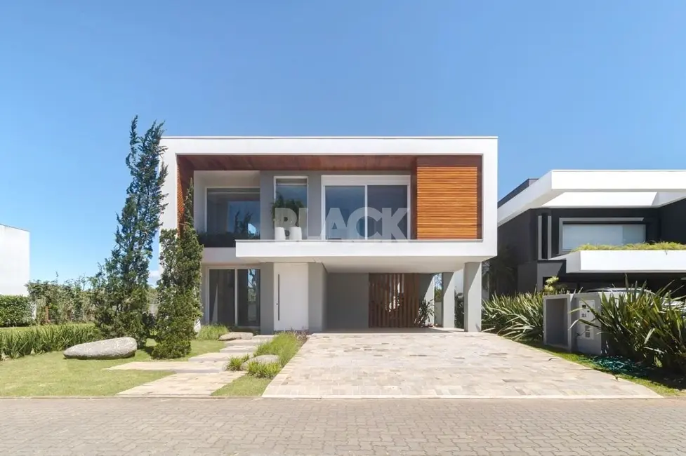 Foto 1 de Casa de Condomínio com 4 quartos à venda, 260m2 em Torres - RS
