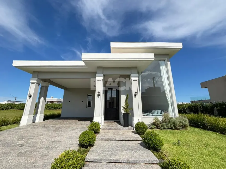Foto 1 de Casa de Condomínio com 3 quartos à venda, 230m2 em Torres - RS