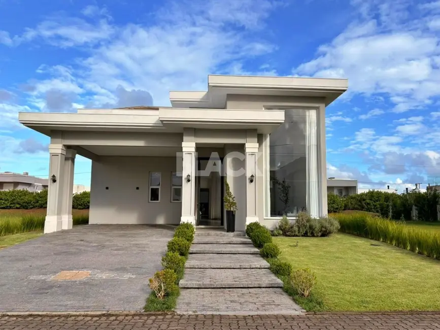 Foto 1 de Casa de Condomínio com 3 quartos à venda, 230m2 em Torres - RS