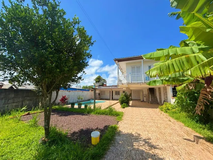 Foto 1 de Casa com 3 quartos à venda, 108m2 em Torres - RS