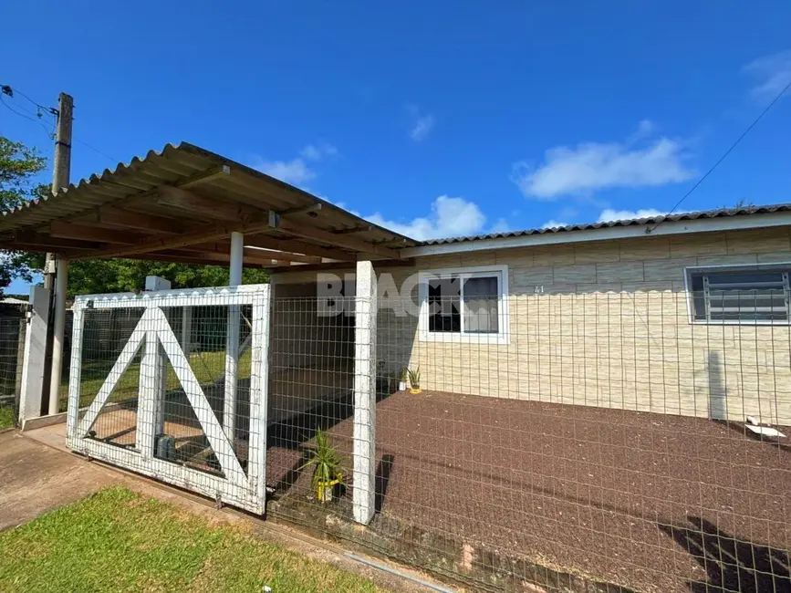 Foto 1 de Casa com 2 quartos à venda, 110m2 em Torres - RS