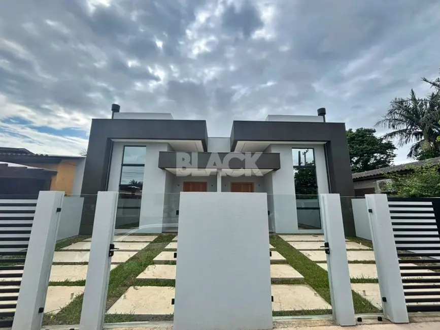 Foto 4 de Casa com 3 quartos à venda, 103m2 em Torres - RS