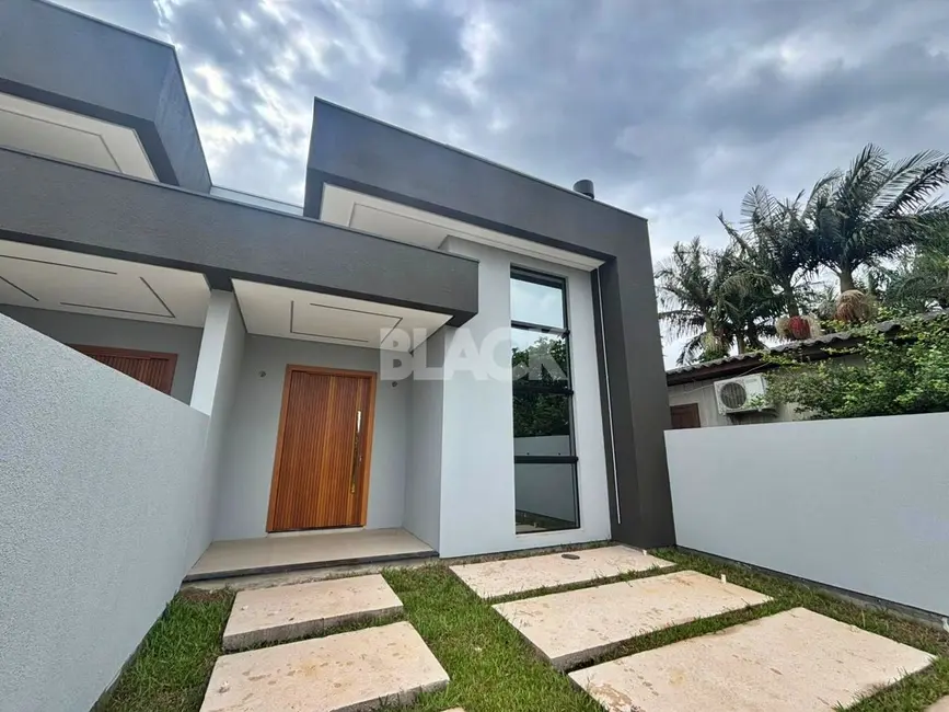 Foto 3 de Casa com 3 quartos à venda, 103m2 em Torres - RS