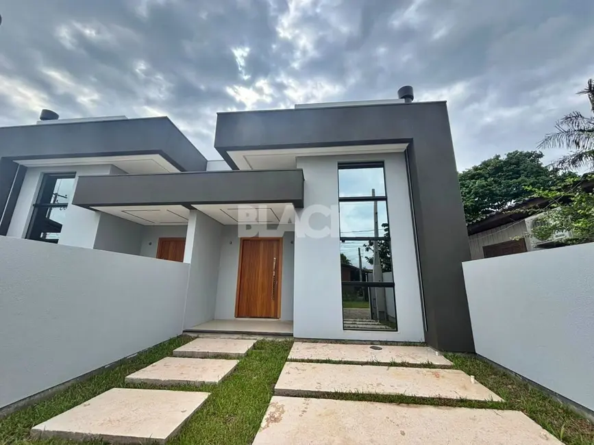 Foto 2 de Casa com 3 quartos à venda, 103m2 em Torres - RS