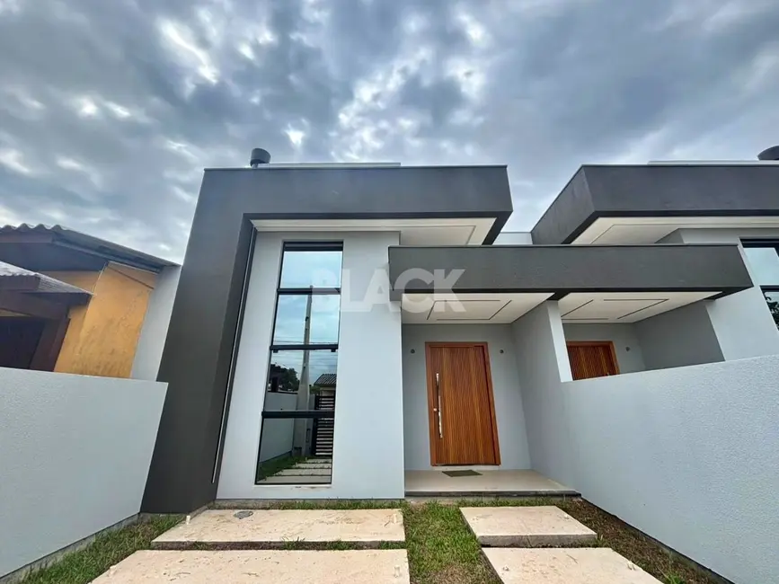 Foto 1 de Casa com 3 quartos à venda, 103m2 em Torres - RS