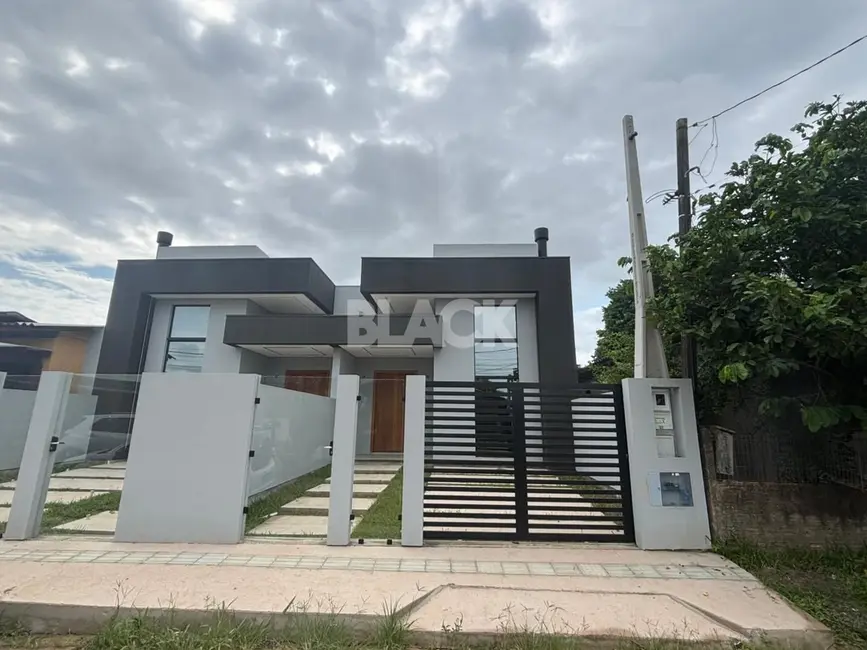 Foto 3 de Casa com 3 quartos à venda, 103m2 em Torres - RS