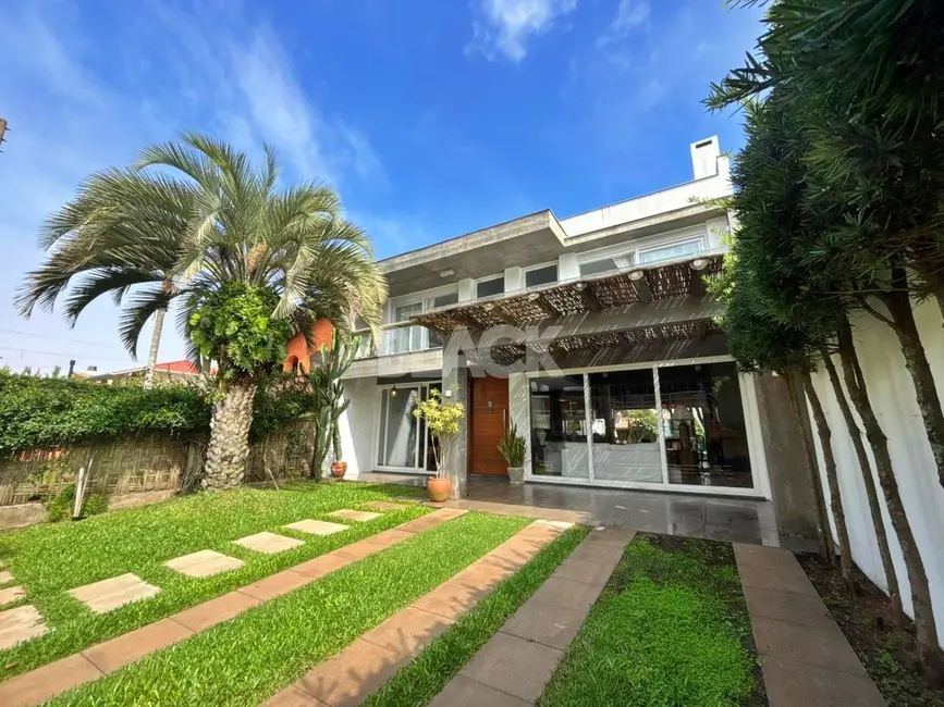 Foto 1 de Casa com 4 quartos à venda, 338m2 em Torres - RS