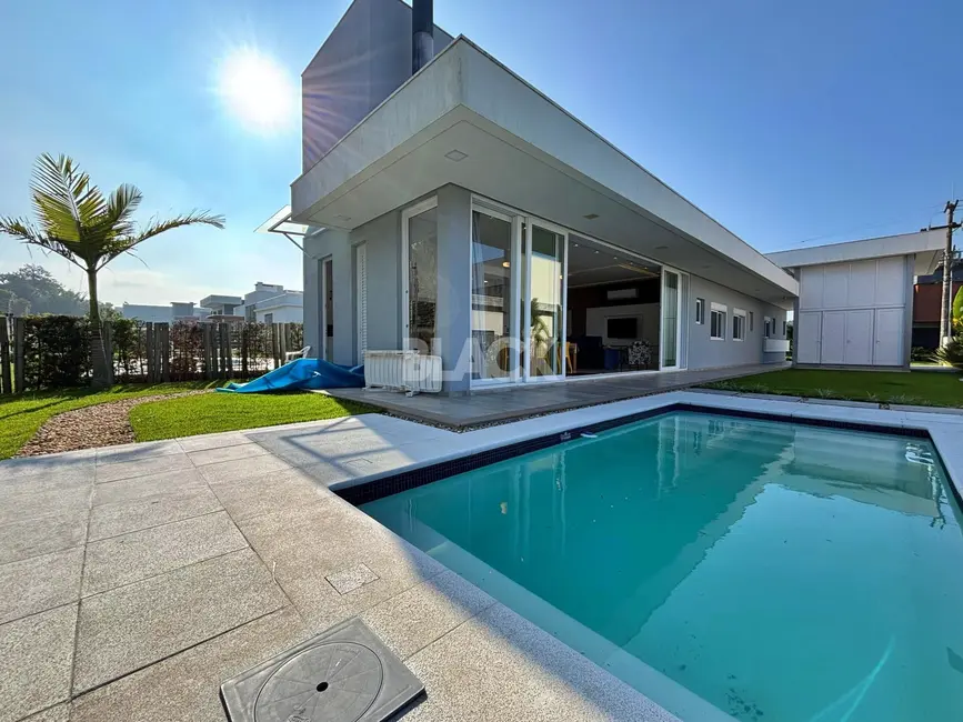 Foto 9 de Casa de Condomínio com 4 quartos à venda, 230m2 em Torres - RS