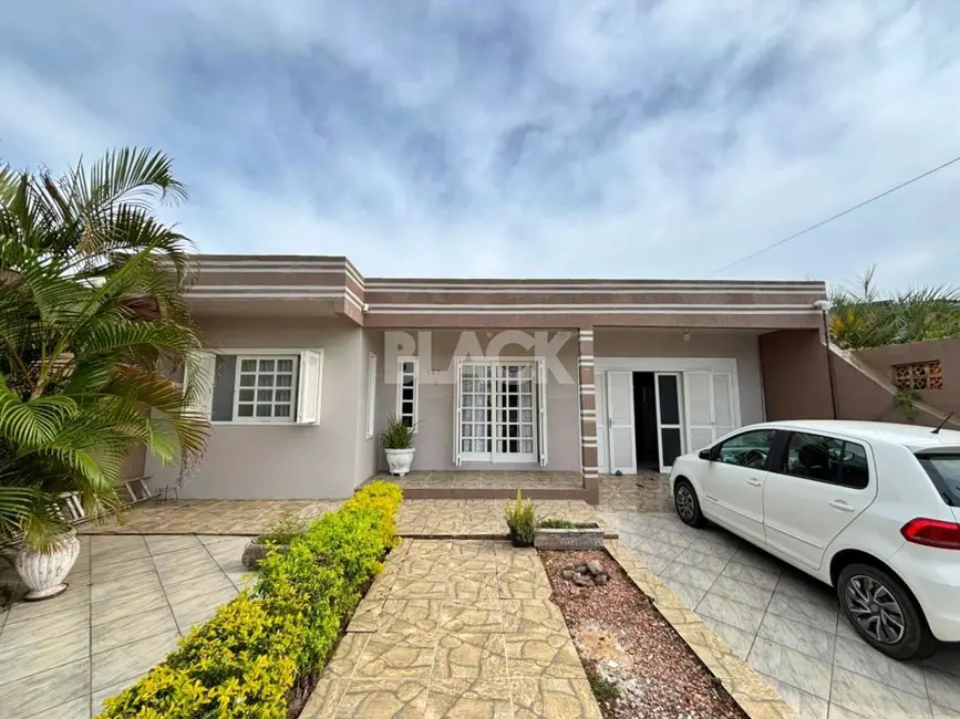 Foto 1 de Casa com 4 quartos à venda, 171m2 em Torres - RS