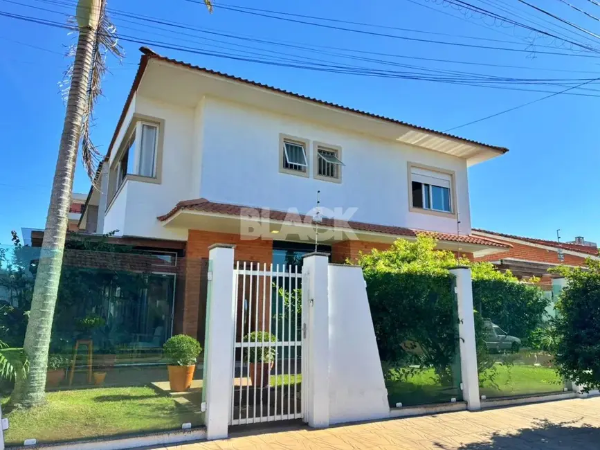 Foto 1 de Casa com 3 quartos à venda, 110m2 em Torres - RS
