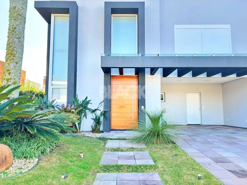 Foto 2 de Casa de Condomínio com 3 quartos à venda, 262m2 em Torres - RS