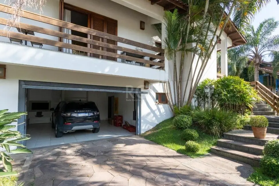 Foto 2 de Casa com 4 quartos à venda, 452m2 em Cavalhada, Porto Alegre - RS