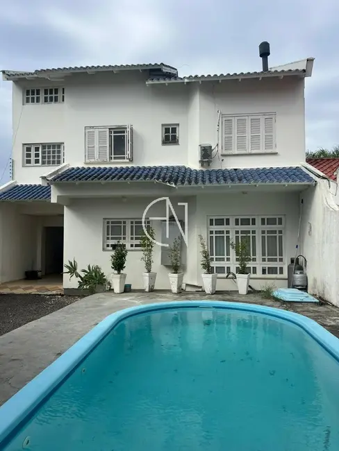 Casa com 4 quartos à venda, 240m2 em Estância Velha, Canoas - RS - imagem 1 Foto 1 de Casa com 4 quartos à venda, 240m2 em Estância Velha, Canoas - RS